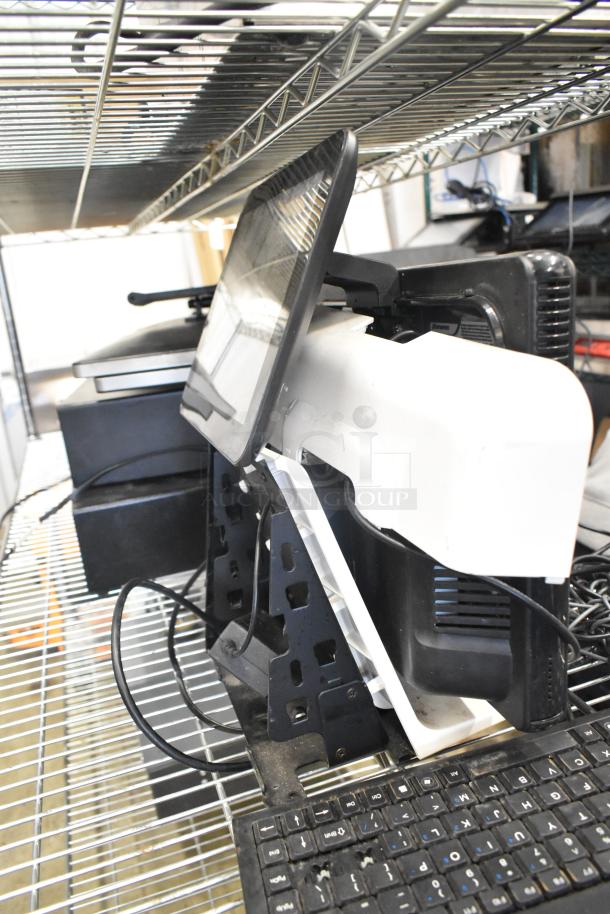 10 assorted items on shelf; includes 2 cash drawers, 5 POS monitors, keyboards, mixed condition.