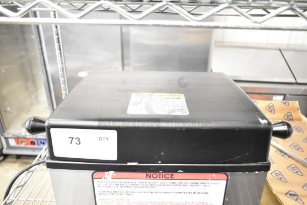 2023 Nemco 6625B Fresh-O-Matic Rethermalizer, black lid, visible condition markings, 120V, label with instructions.