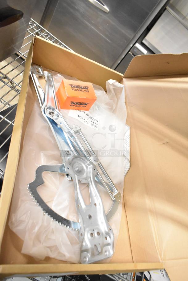 Brand new Dorman 740-404 window regulator with minor scratches and dents, in original packaging.