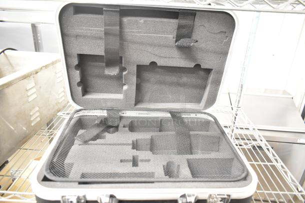 Rae Hard Case with foam interior and securing straps, in excellent condition, ideal for protecting equipment.