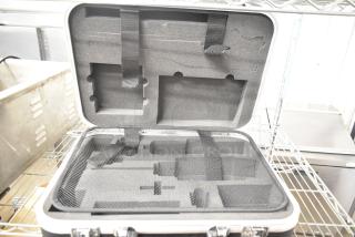 Rae Hard Case with foam interior and securing straps, in excellent condition, ideal for protecting equipment.