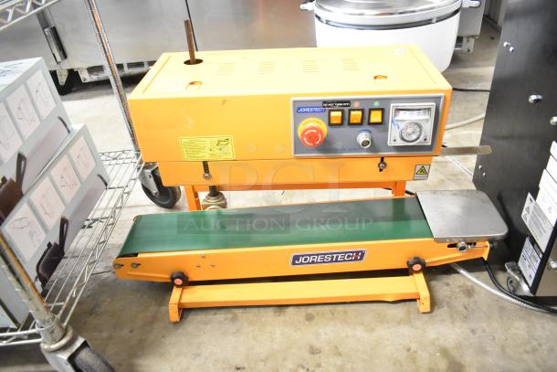 Jorestech CBS-630 countertop continuous band sealer, 110 volts, 1 phase, orange with control panel, used condition.