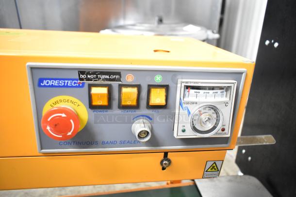 Jorestech CBS-630 countertop band sealer, 110V, features power, heater, and fan controls. Emergency stop button, temperature gauge.