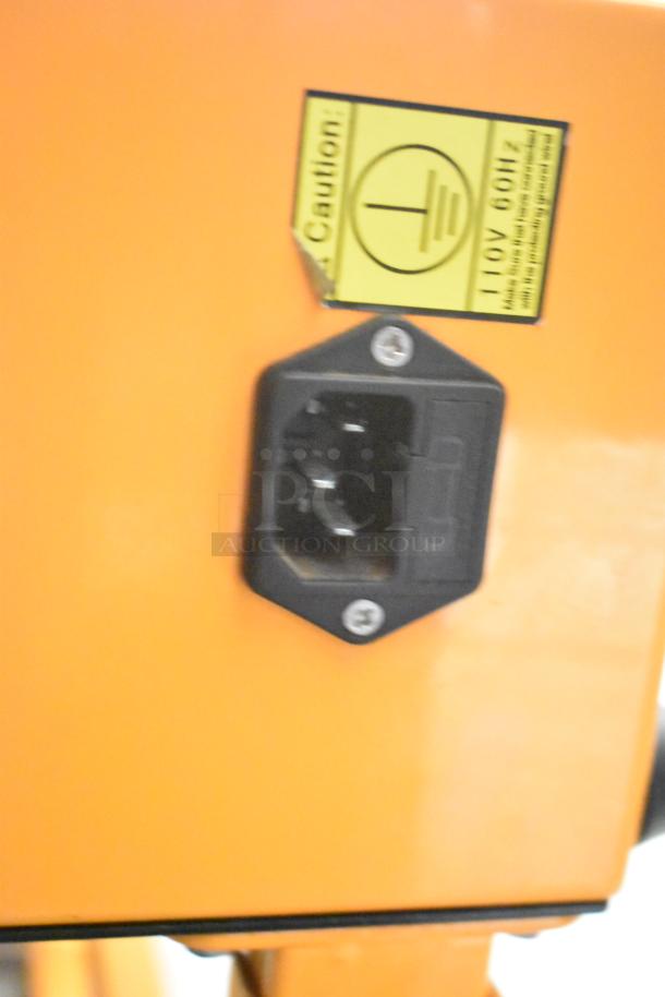 Jorestech CBS-630 Countertop Band Sealer, orange, 110V 60Hz, caution label visible.