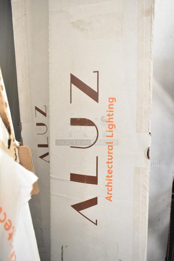 Alt text: New California Accent Lighting ALS210T Luminaire boxes, labeled "Aluz Architectural Lighting." Minor box wear visible.
