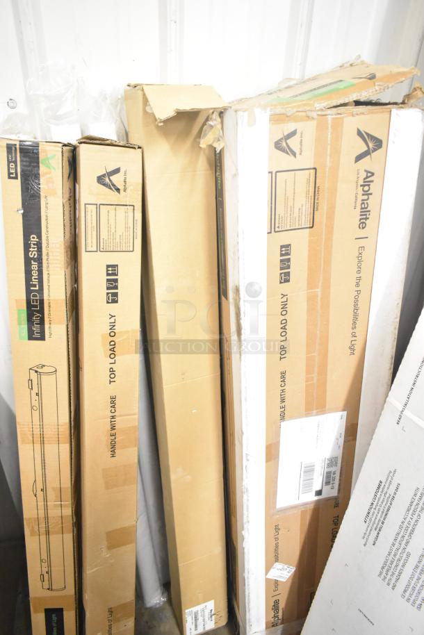 Seven Alphalite Infinity LED Linear Strips in original packaging, brand new with minor box damage.