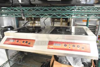 Brand new Avantco 177IC35DB double countertop induction range. Visible control panel; minor scratches and dents. 208-240 Volts.