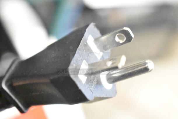 Close-up of a power plug for the Avantco 177IC35DB Double Countertop Induction Range, showing a standard three-prong connector.