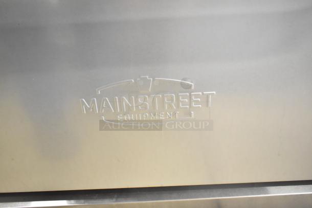 Mainstreet Equipment logo on stainless steel surface of 2025 Mainstreet 541E60N commercial natural gas range.