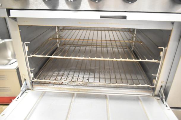 Mainstreet 541E60N range oven interior. Features two racks, showing slight signs of use. Perfect for commercial kitchens.