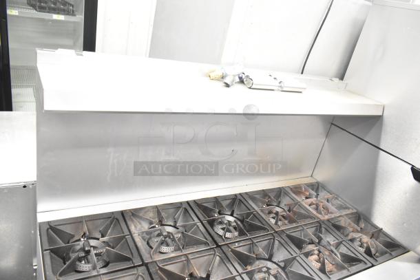 2025 Mainstreet 541E60N gas range with 10 burners, 2 ovens, over shelf, and backsplash. Features durable construction.