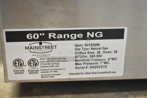 Mainstreet 541E60N commercial natural gas 10-burner range, 2 ovens, over shelf, back splash. Model label details visible.