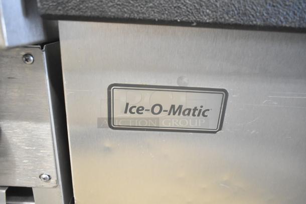 2019 Ice-O-Matic CIM1446HA4 ice machine, 1520 lb capacity, half dice cubes, on commercial bin. Stainless steel finish.