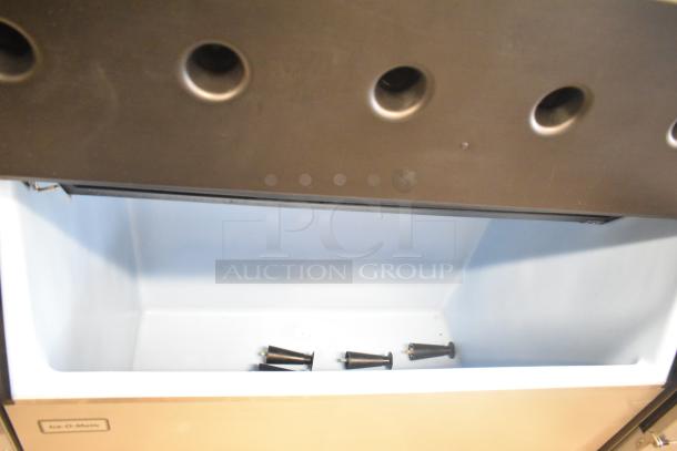 2019 Ice-O-Matic CIM1446HA4 ice machine on commercial bin, 1520 lb capacity, 208-230V, 1 phase, clean interior, Ice-O-Matic label.