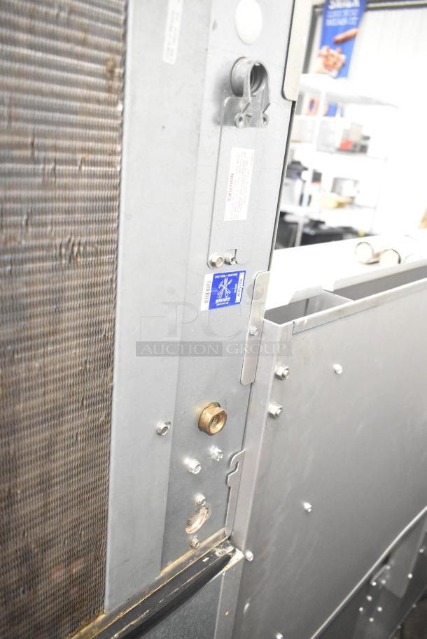 2019 Ice-O-Matic CIM1446HA4 ice machine on bin, 1520 lb capacity, visible wiring and label details, commercial use.