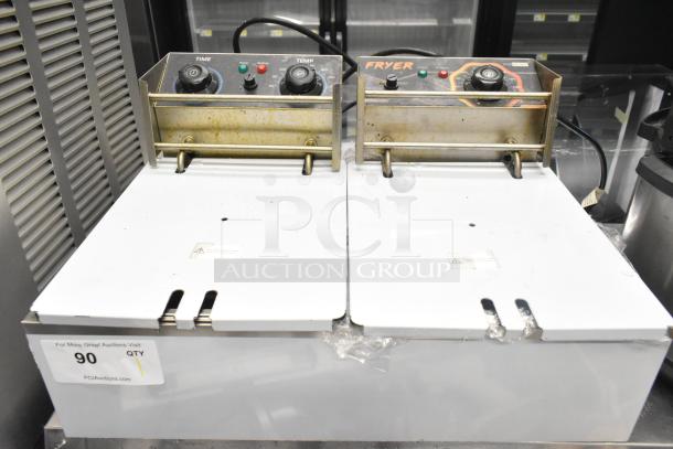 VH1118 countertop electric 2-bay fryer with lids, 110V, 1-phase. Control knobs and indicators visible, showing wear.