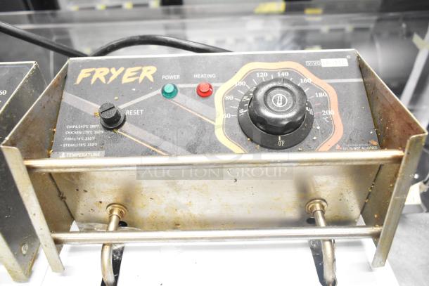 VH1118 countertop electric 2-bay fryer with 2 lids, 110 volts, 1 phase, control panel with power and heating indicators.