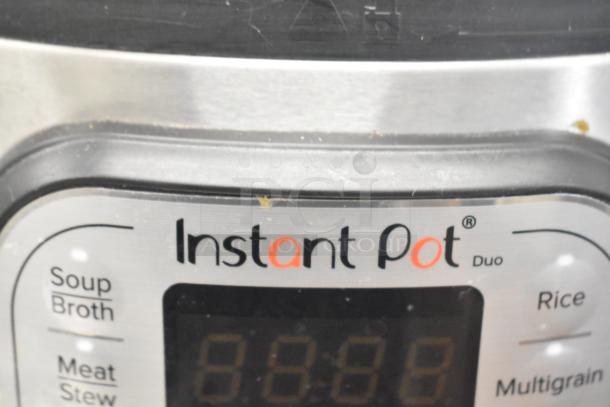 Instant Pot Duo 80 v5 electric pressure cooker, 120V, 1 Phase, with multiple cooking modes visible, in good condition.