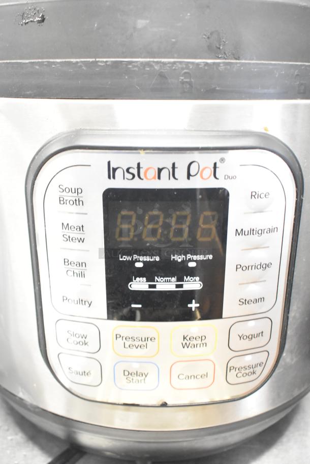 Instant Pot Duo 80 v5 electric pressure cooker, control panel visible, multiple cooking modes, 120 volts, 1 phase.