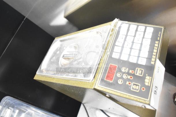 Autata ATT-9LS countertop fructose machine, 110 volts, 1 phase. Features control panel with buttons. Good condition.