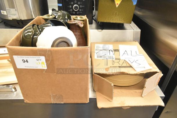 Lot of various items including ceramic bowls, vases, and poly trays in cardboard boxes. Box labeled "ALL TRAYS."