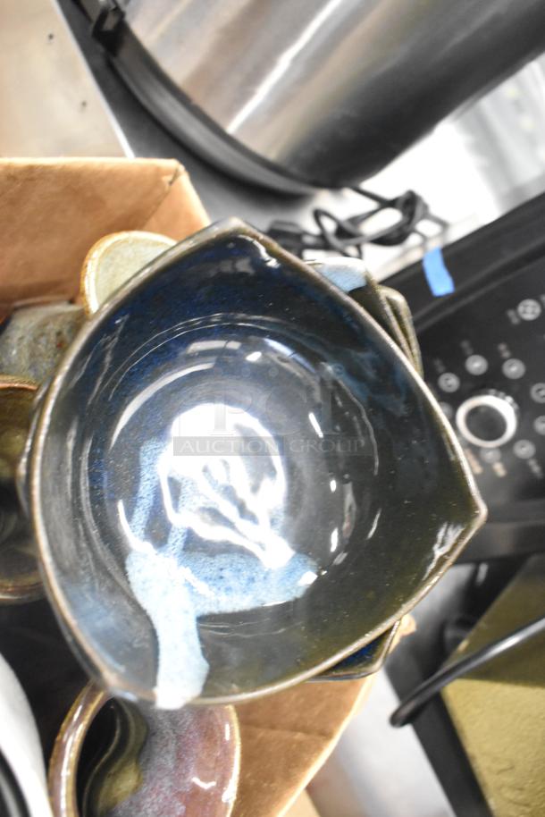 Lot of ceramic bowls with glossy blue glaze, various vases, and poly trays, in fair condition.