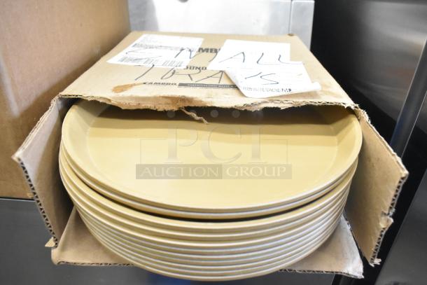 Box of tan poly trays, partially open, with handwritten labels indicating "ALL TRAYS."