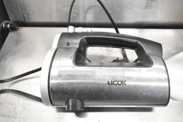 Aicok HM833 Hand Blender, stainless steel and black, visible wear, offers versatile blending.
