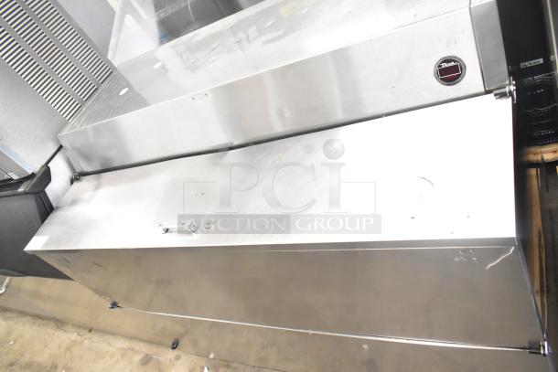 True TMC-58-S Commercial Milk Cooler in stainless steel. Features 115 volts, 1 phase. Visible logo and minor surface marks.