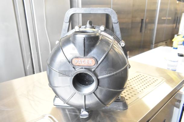 Pacer Baldor SuperE Motor, 230/460 Volts, 3 Phase, black casing, labeled "Pacer," "Made in USA," in good condition.