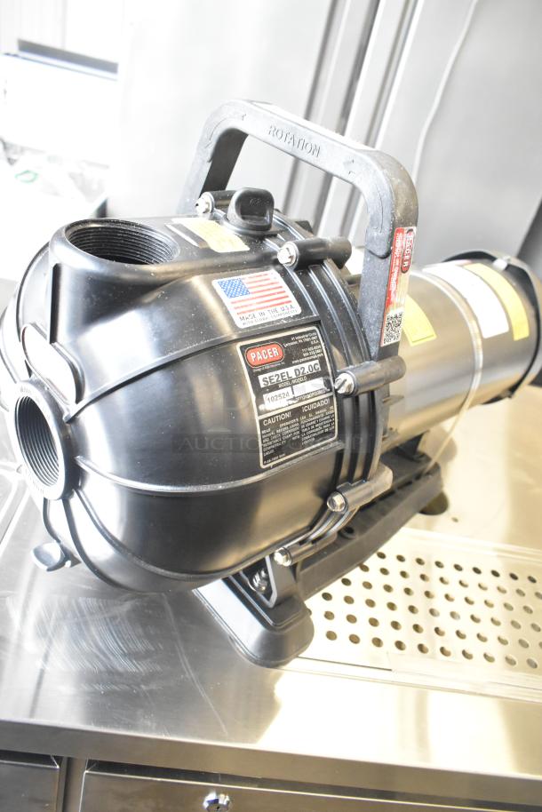 Pacer Baldor SuperE Motor, 230/460 Volts, 3 Phase, Model SE2EL D2.0C. Features visible labels and handle, in good condition.