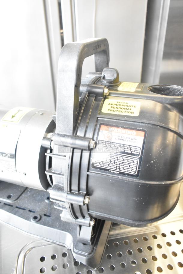 Pacer Baldor SuperE Motor, 230/460V, 3 Phase, with warning labels. Excellent condition, sturdy black casing.