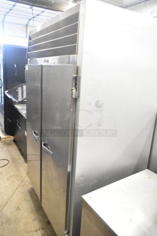 Traulsen G20010 commercial 2-door reach-in cooler, 115 volts, 1 phase. Stainless steel, used condition, visible vent and hinges.