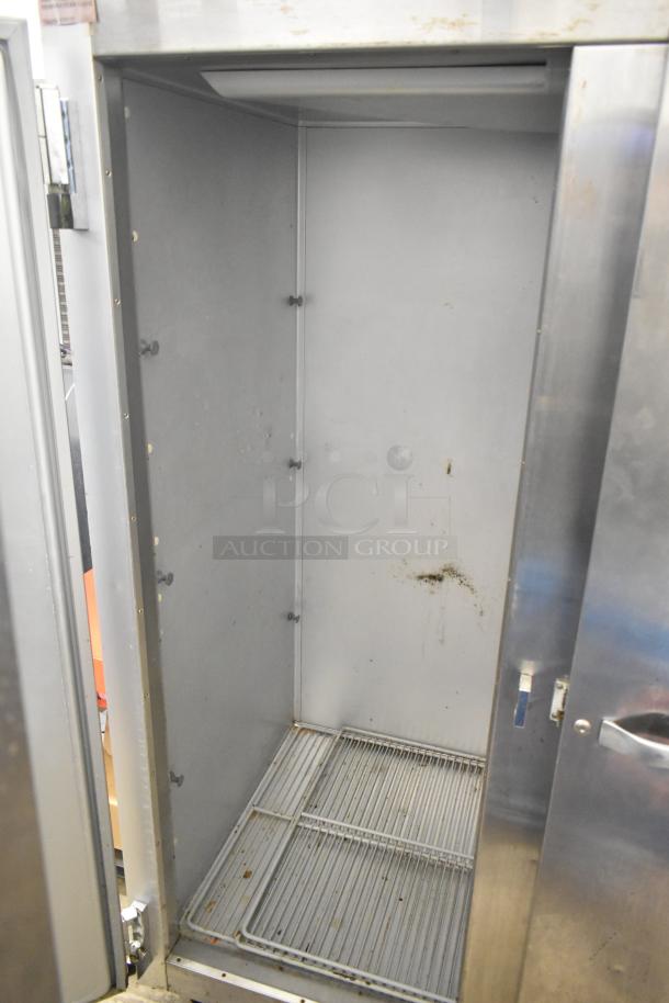 Traulsen G20010 Commercial 2 Door Reach In Cooler, 115V, 1 Phase. Stainless steel, interior shelf, used condition.