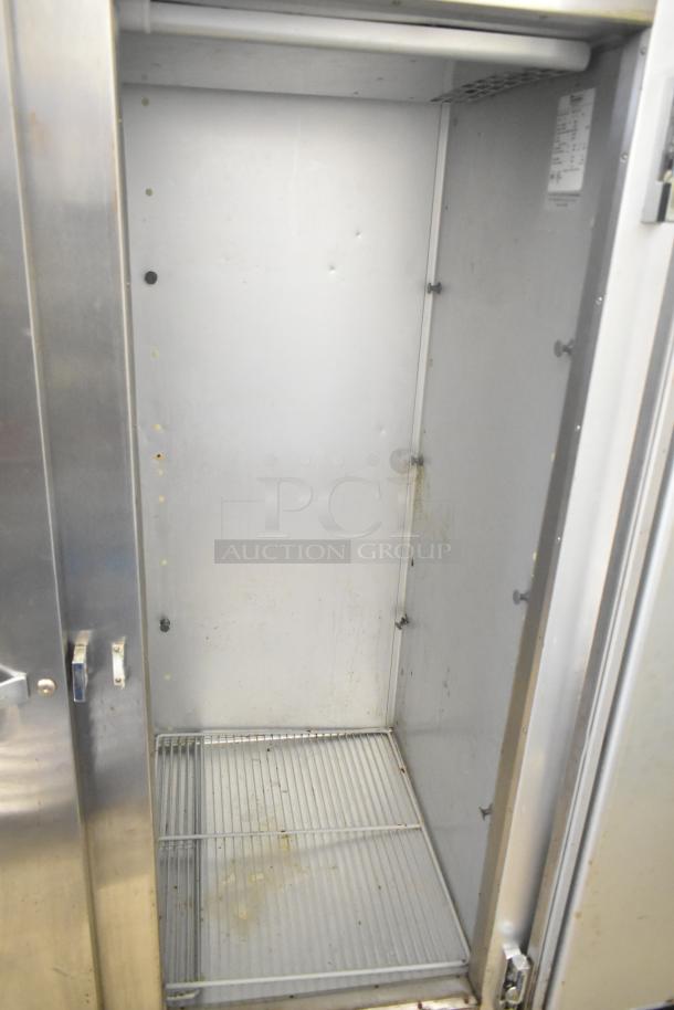 Traulsen G20010 commercial 2-door reach-in cooler, stainless steel, 115 volts, 1 phase, interior shelf visible, used condition.