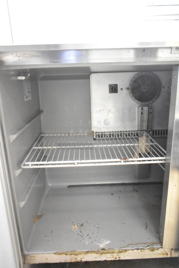 Victory UR-48-SST 2 Door Undercounter Cooler, 115V, shows wear and rust on interior surfaces, single shelf included.