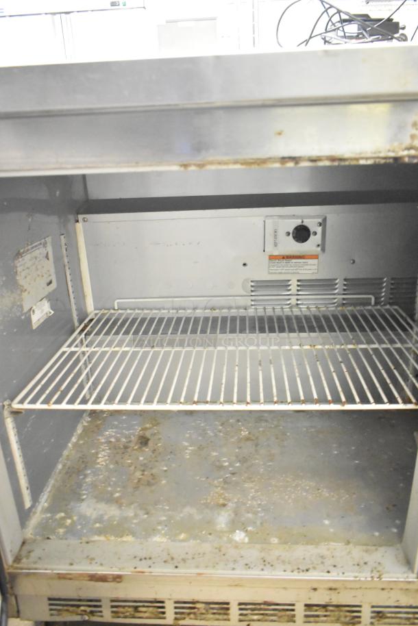 Beverage Air WTR60A commercial undercounter cooler, two-door, on casters, 115V, 1 phase. Visible wear and interior marks.