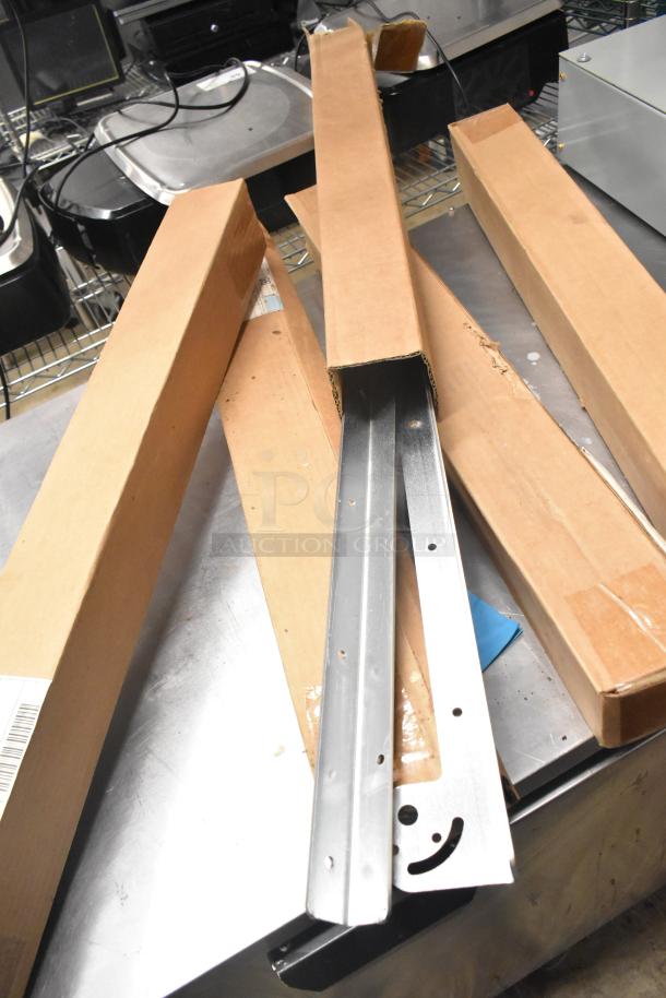 Cabinet with bracket hinge sets, steel, new condition, in cardboard packaging, showing metal brackets with pre-drilled holes.