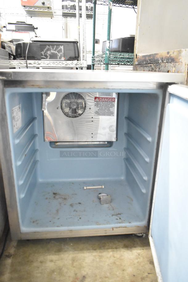 2018 Delfield 406P-STAR4 single door undercounter cooler, interior view. Visible fan, caution label, and wear marks. 115V, 1-phase.