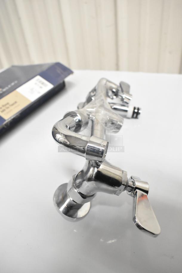Brand new Waterloo 750AF14 14" pre-rinse add-on faucet, chrome finish, slight scratches, boxed, model details visible.