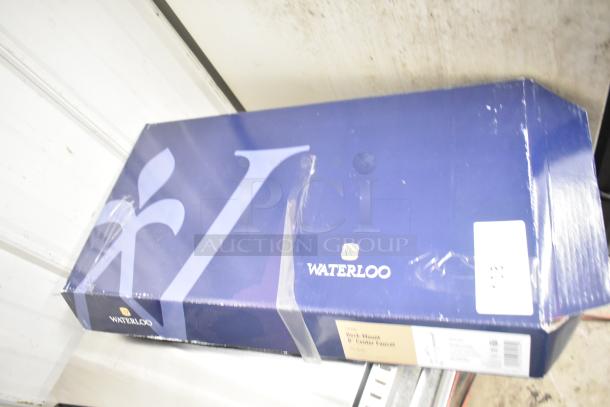 Box of Waterloo 750PRD8X 1.15 GPM pre-rinse faucet, 8" centers, brand new, scratch and dent condition, visible packaging labels.