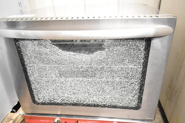 Avantco half-size convection oven, model 177CO28M, with shattered glass. New scratch and dent condition. 2.3 cu. ft. 208/240V, 1 phase.