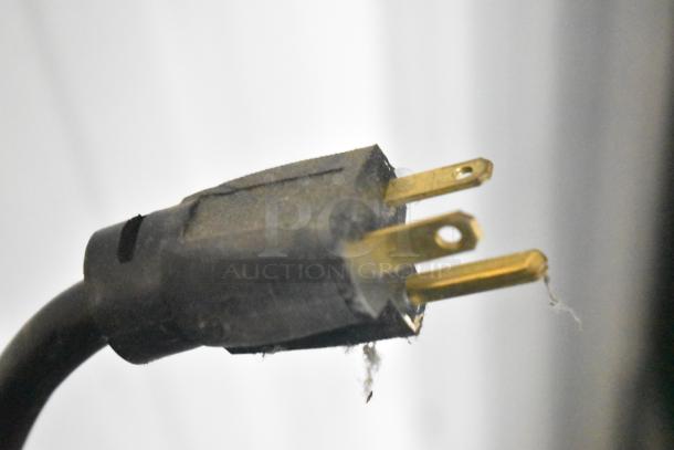 Structural Concepts Oasis B42 plug close-up; shows standard 120V, 1-phase power connection for merchandiser.