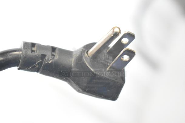 Close-up of a three-pronged electrical plug for the 2017 Alto Shaam 750-S heated cabinet, showcasing its 120-volt compatibility.