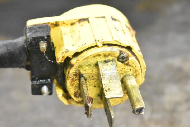 Close-up of a plug for the Garland E24-36G commercial griddle, showing signs of wear and discoloration.