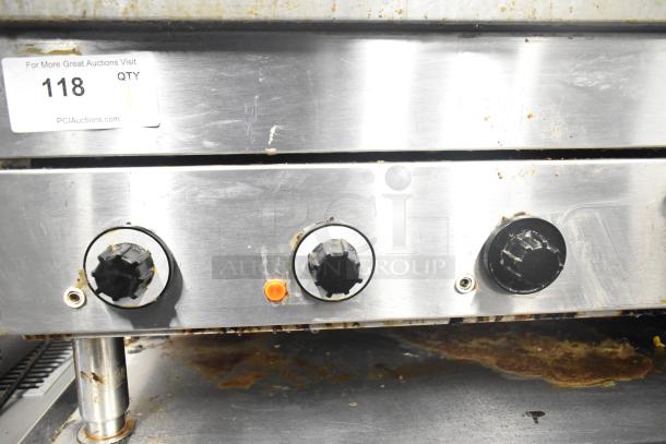 Garland E24-36G commercial electric griddle, stainless knobs, wear visible. 208V, 1/3 phase. Auction tag 118 shown.