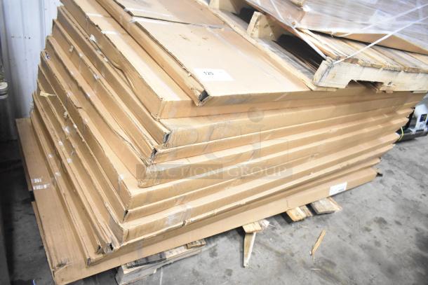 Stack of 16 new Lavex workbench tops in boxes, including 30" x 72" and 30" x 48" maple tops, on a pallet.