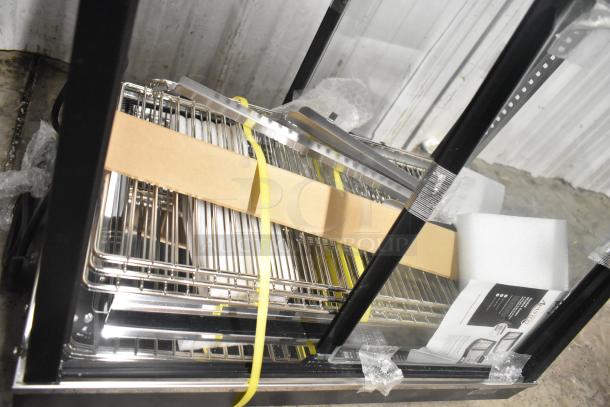 Brand new 2025 Avantco 177HDC26 26" heated display case, 3 shelves, sliding doors, minor scratches; 120V, 1 phase.