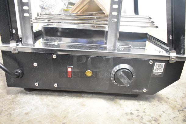 Avantco 177HDC26 heated display case base with control panel, power switch, and temperature dial. Black metal housing.