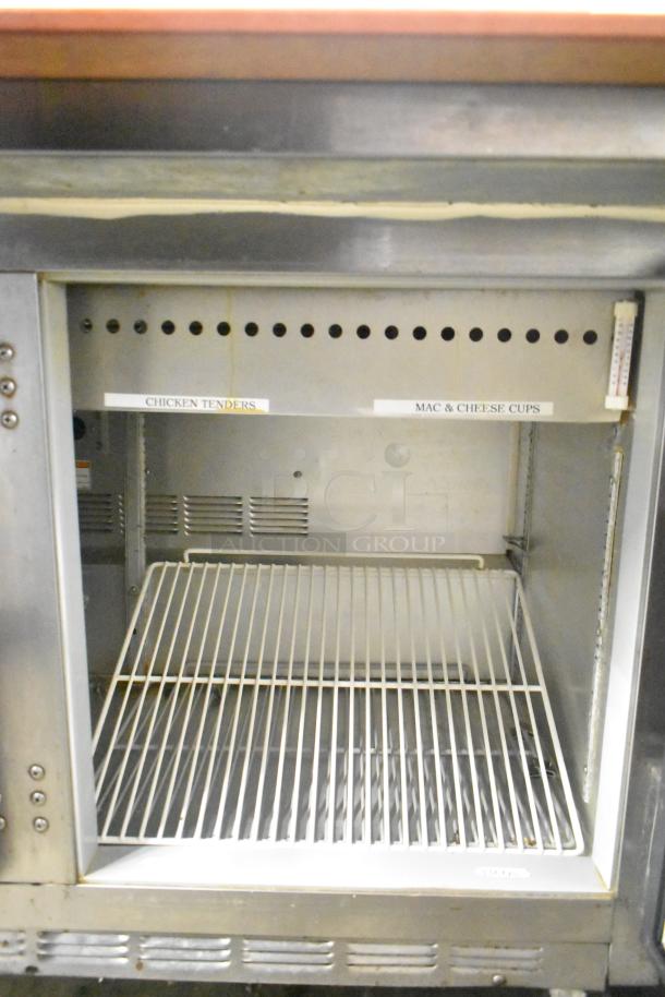 Beverage Air commercial sandwich salad prep table Bain Marie on casters, 115 volts, 1 phase, shelves labeled for food items.